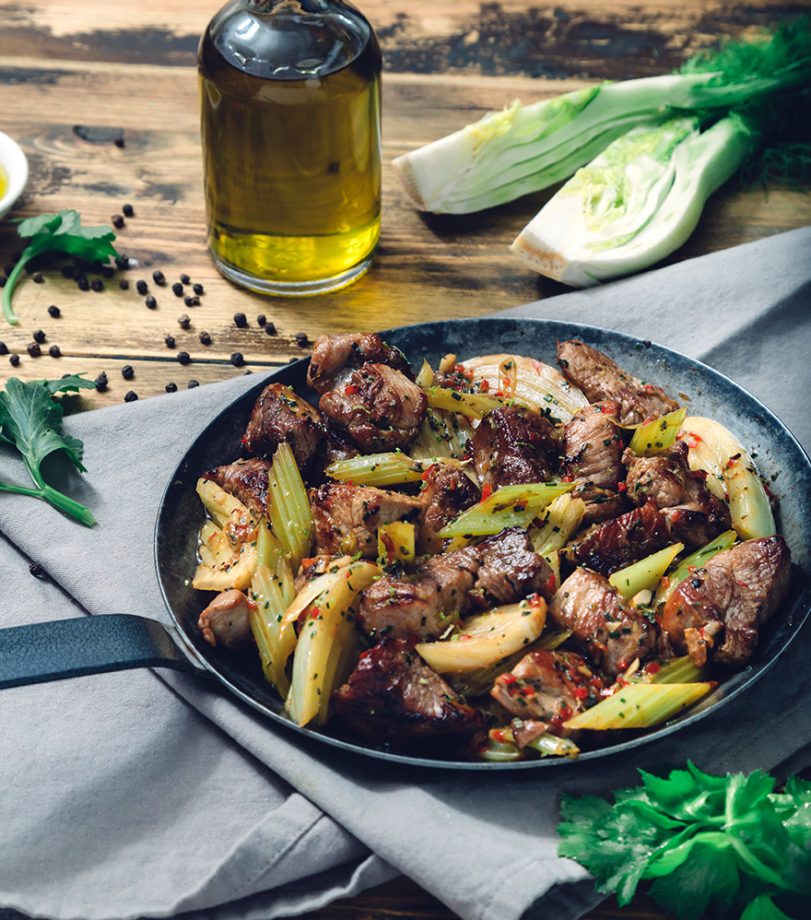 Fried pork (tigania) En Elladi, with celery and fennel